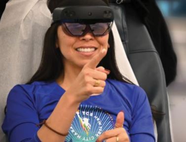 Blood donor experiencing the virtual reality glasses as she donates.