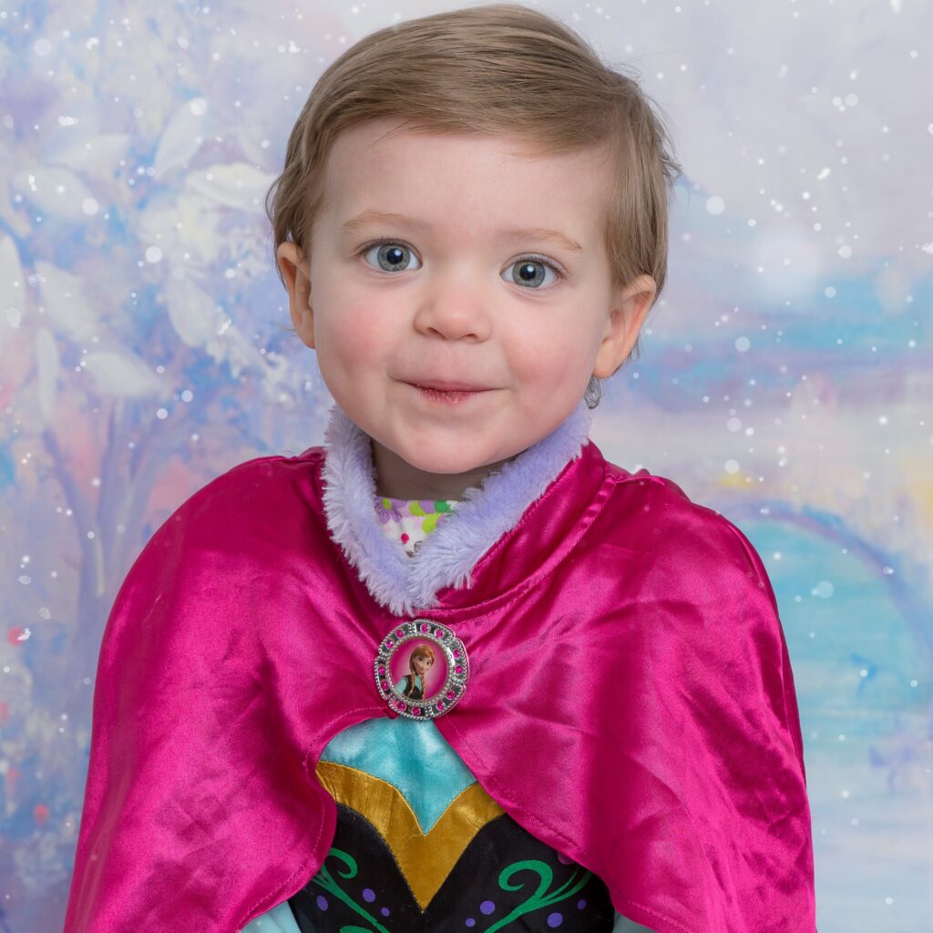 A young Emerson in a cape.