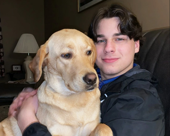 Matthew Dennison, Rhode Island Blood Center blood recipient, with his dog.