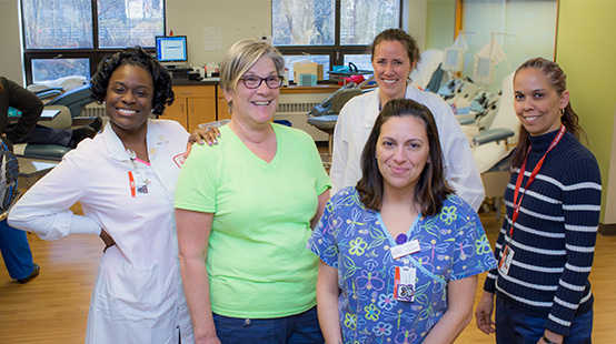 Group of five female Connecticut Blood Center staff members at blood donor location.