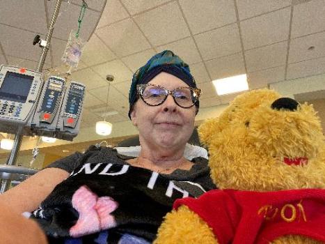 Blood donor with stuffed animal.