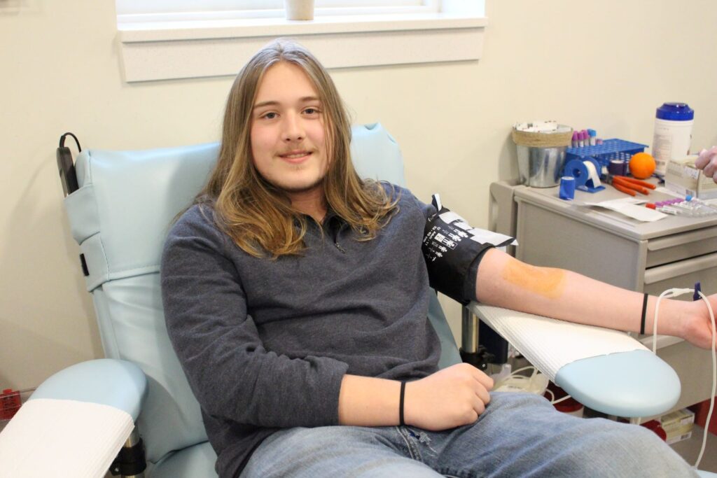 Benjamin Parsons donating blood.