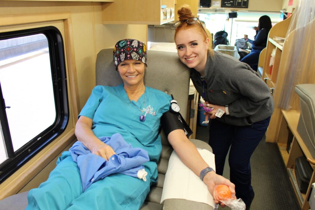 BBD staff member with a blood donor.
