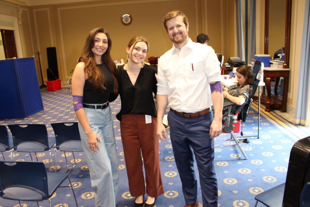 Three smiling blood donors athe the U.s. House of Representatives.