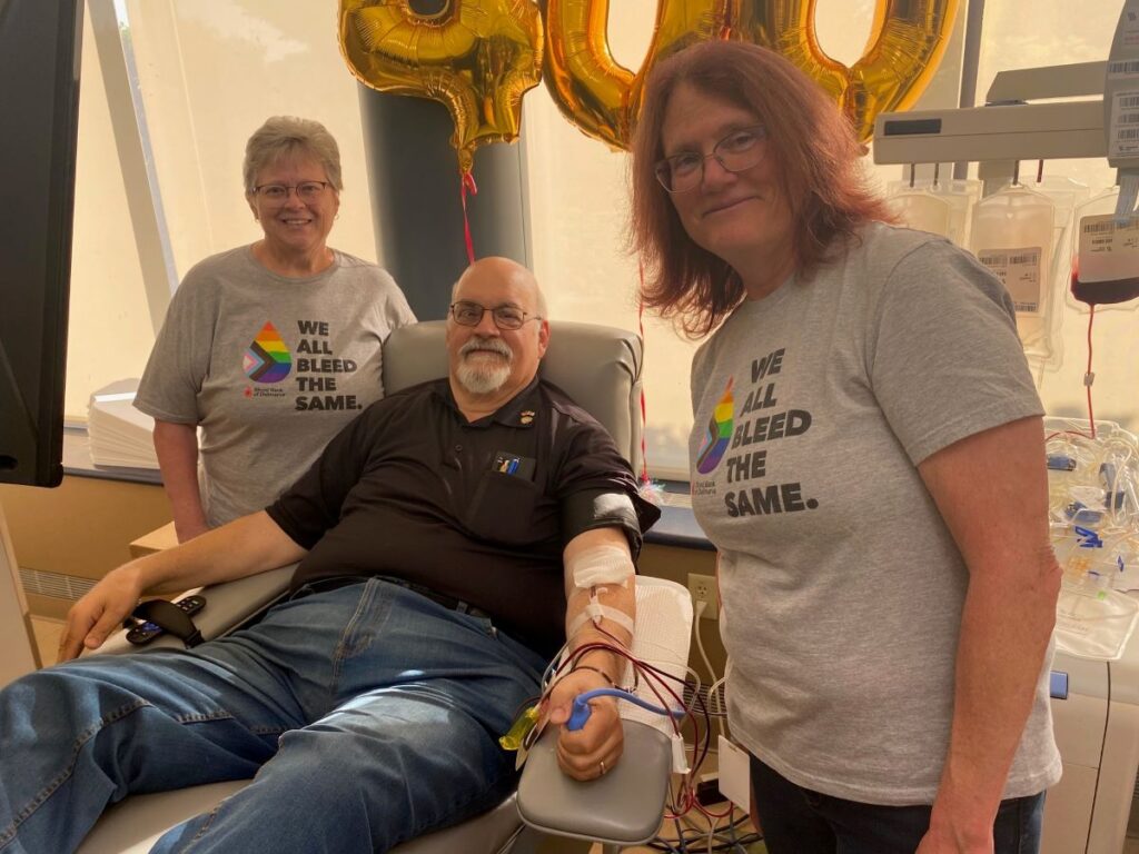 Three smiling blood donors.